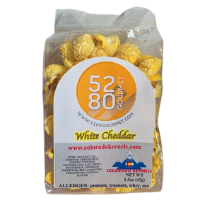 White cheddar gourmet popcorn with a rich and creamy cheese coating made in Colorado
