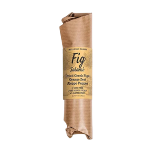 Hellenic Farms vegan fig salami with orange zest sliced on charcuterie board